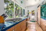 One of a kind artful kitchen area with open views looking out at ocean and coast